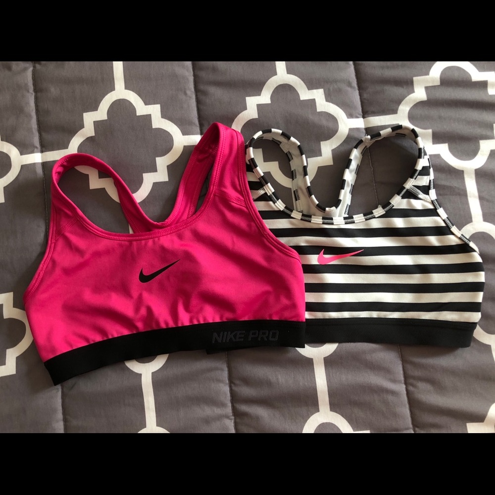 Pair of Pink and Striped Nike Sports Bras